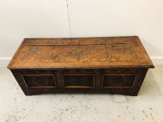 An Oak coffer with carved panels 122cm x 45cm High