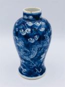 A Chinese vase blue and white vase with dragon decoration 13cm tall. Kangxi period.