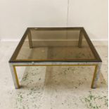 A Harrods Vintage brass and smoked glass coffee table.