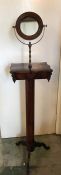 A Victorian mahogany shaving stand with mirror and drawer