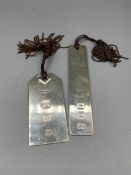 A pair of hallmarked silver bookmarks.