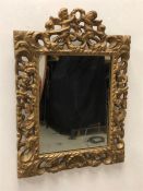 An 18th Century mirror with cherub design