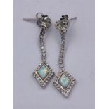 A Pair of Silver CZ and Opal Paneled drop earrings