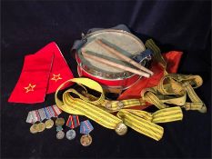 A selection of Russian Military items to include, drum, naval belts and some medals.