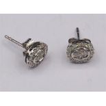 A Pair of 18ct White gold diamond earrings of 30 points.