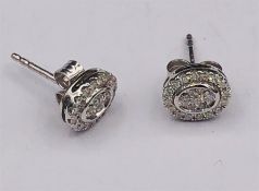 A Pair of 18ct White gold diamond earrings of 30 points.