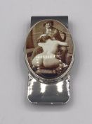 A silver money clip with enamel set nude image