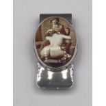 A silver money clip with enamel set nude image