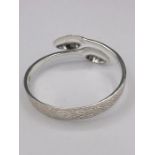 A silver bangle, Artisan made from silver spoons