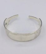 A Hallmarked silver bangle, made by Artisan from silver cutlery..