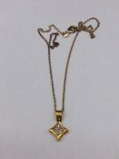 A 14ct yellow gold diamond star shaped pendant necklace