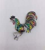 A Silver and Plique A Jour Brooch in the form of a Rooster.