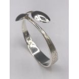 A silver bangle, Artisan made from silver spoons