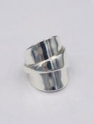 A solid silver spoon ring made from Antique cutlery by an Artisan. Successful bidders can notify