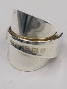 A solid silver spoon ring made from Antique cutlery by an Artisan. Successful bidders can notify