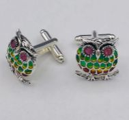 A Pair of Silver and Plique A Jour cufflinks