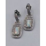 A pair of silver CZ and opal drop earrings