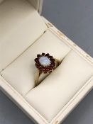 A 9ct gold Opal and Garnet ring
