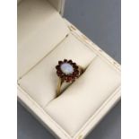 A 9ct gold Opal and Garnet ring