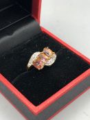 A 9ct gold Topaz and Diamond ring