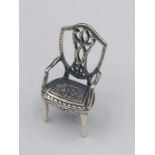 A Sterling Silver figure of a chair