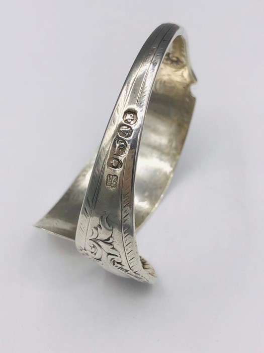 A Hallmarked silver bangle, made by Artisan from silver cutlery.. - Image 2 of 3