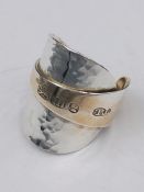 A solid silver spoon ring made from Antique cutlery by an Artisan. Successful bidders can notify