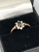 A 9ct gold and CZ cluster ring