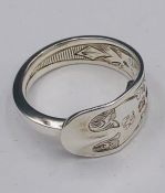 A solid silver spoon ring made from Antique cutlery by an Artisan. Successful bidders can notify