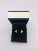 A Pair of White Gold diamond stud earrings of 1.4CT's