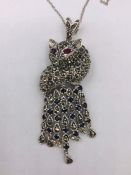 A Silver and Marcasite Fox Form necklace with ruby eyes