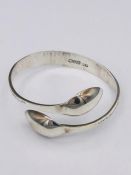 A Hallmarked silver bangle, Artisan made from silver spoons