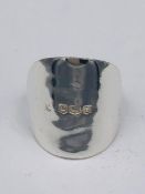 A solid silver spoon ring made from Antique cutlery by an Artisan. Successful bidders can notify