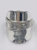 A solid silver spoon ring made from Antique cutlery by an Artisan. Successful bidders can notify