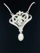 A silver and opal set pendant necklace