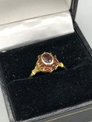 A 9ct Gold and ruby cluster ring