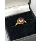 A 9ct Gold and ruby cluster ring