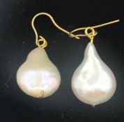 A set of pearl earrings