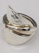 A solid silver spoon ring made from Antique cutlery by an Artisan. Successful bidders can notify