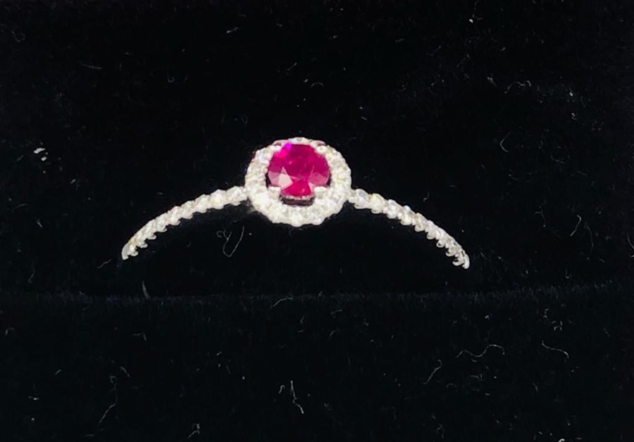 An 18ct white gold ruby and diamond ring