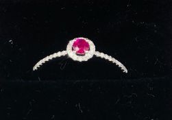 An 18ct white gold ruby and diamond ring