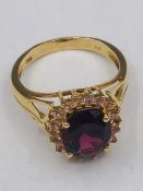 A 14ct yellow gold garnet and diamond ring of 4.9ct's