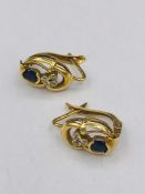 A Pair of yellow gold sapphire and diamond earrings