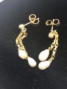 A set of pearl drop earrings on 9ct gold