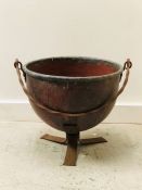 A Copper planter, cauldron on stand style.