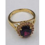 A 14ct yellow gold garnet and diamond ring of 4.9ct's