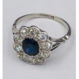 A Sapphire and Diamond Daisy ring on a platinum band (4.1g)