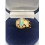 An Opal Arts and Crafts ring, 14ct setting
