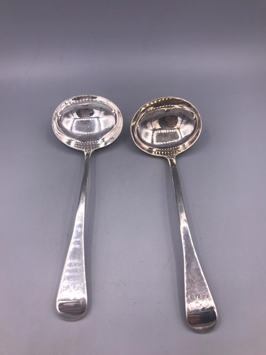 A Pair of silver sauce ladles.