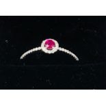 An 18ct white gold ruby and diamond ring